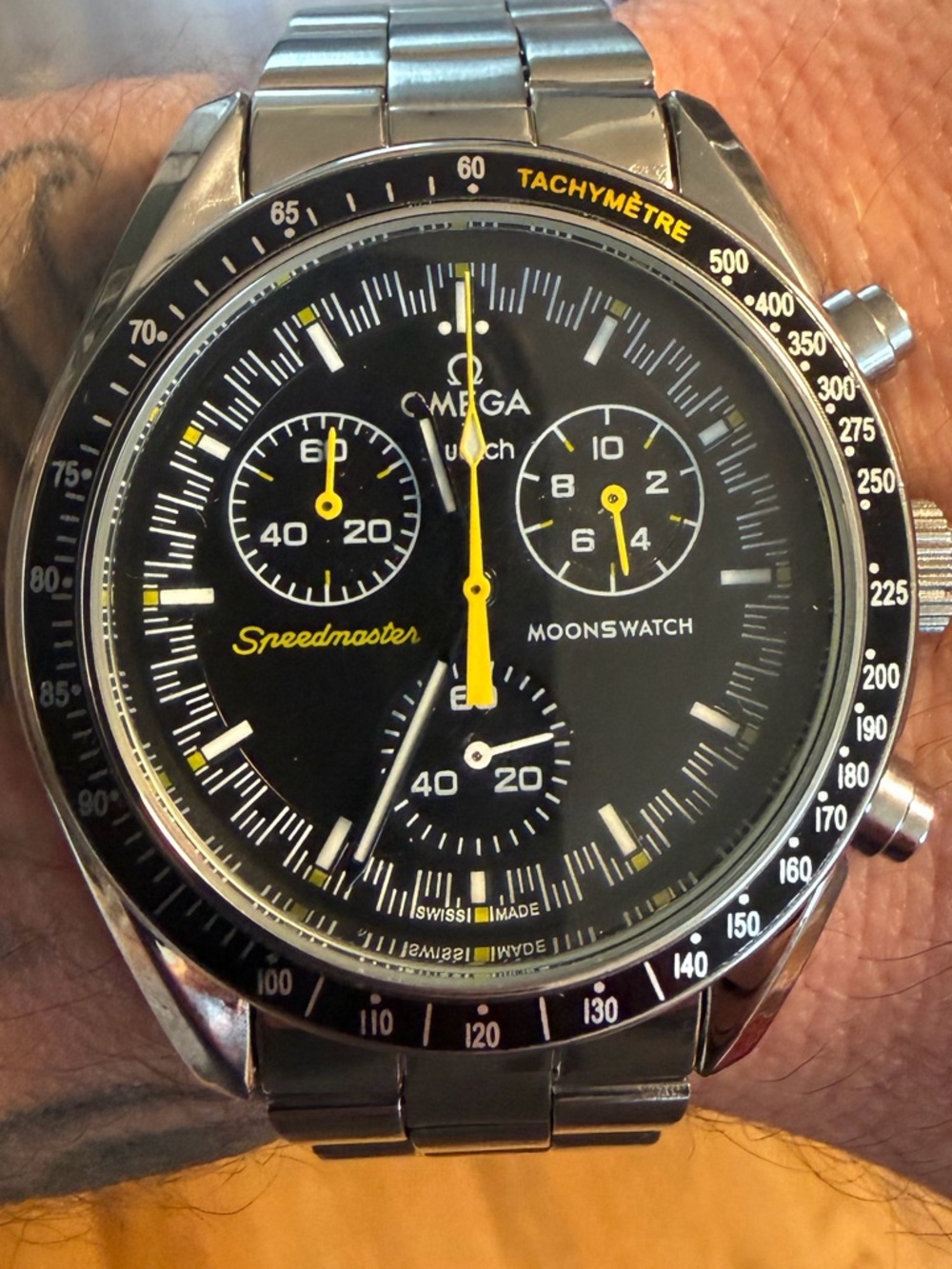 Moonswatch MOD with black and yellow bezel stainless band and silicone band